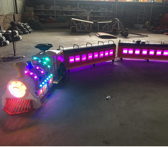 Children sit on electric train